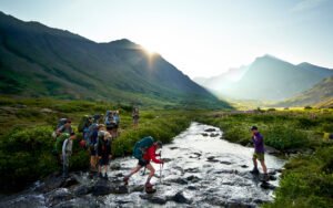 Teen adventure summer camp backpacking through Alaska Mountains and Coast