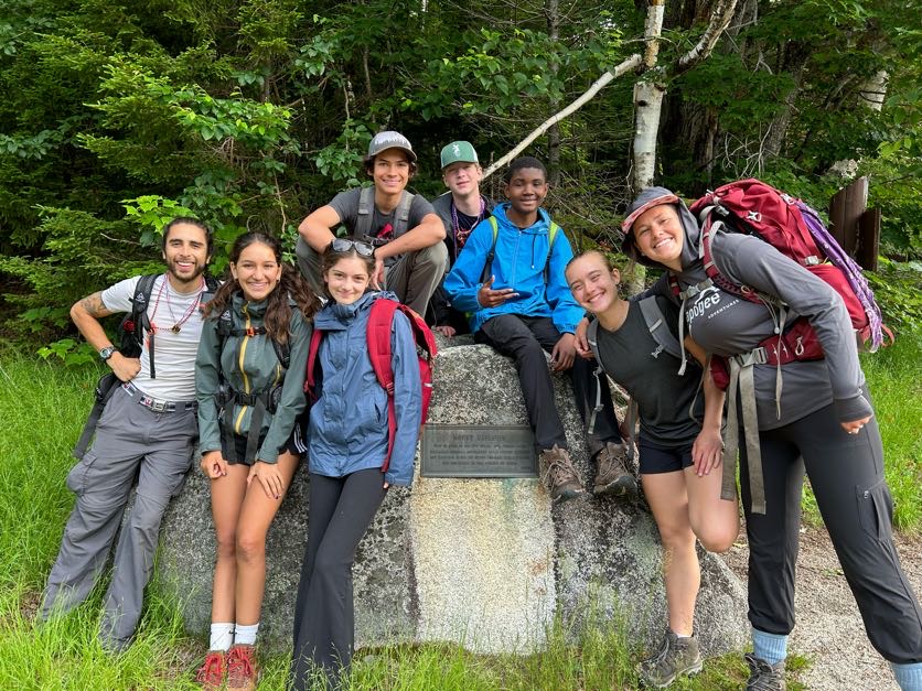 Apogee group of teenagers hiking in Maine