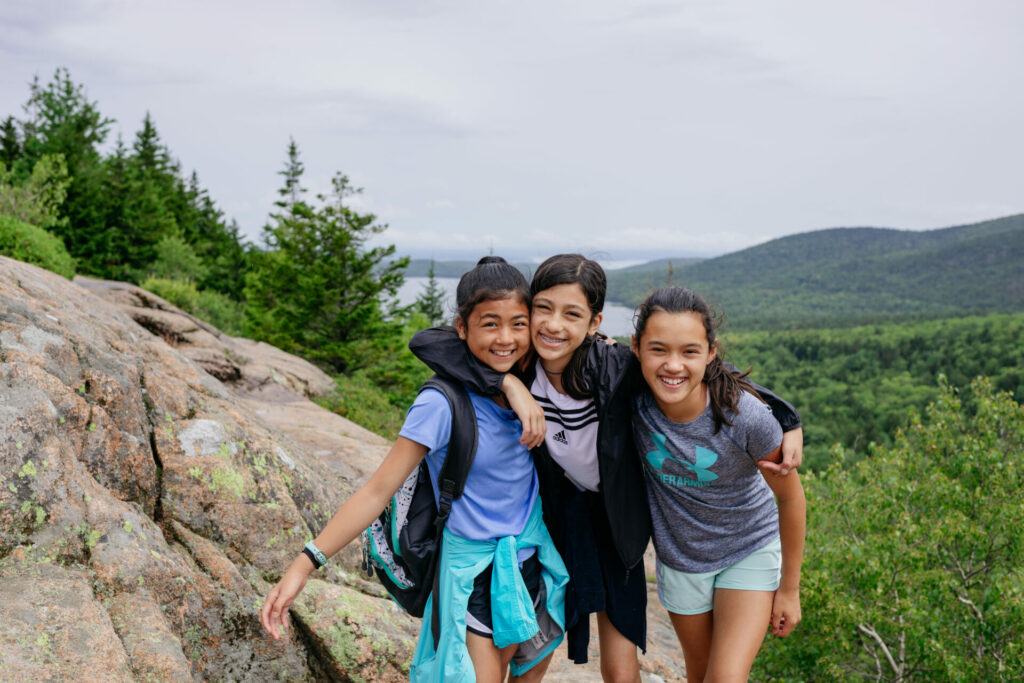 Kids hiking in Acadia National Park in the summer