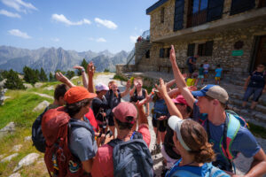 Teen adventure camp group celebrating hiking in the Spanish Pyrenees