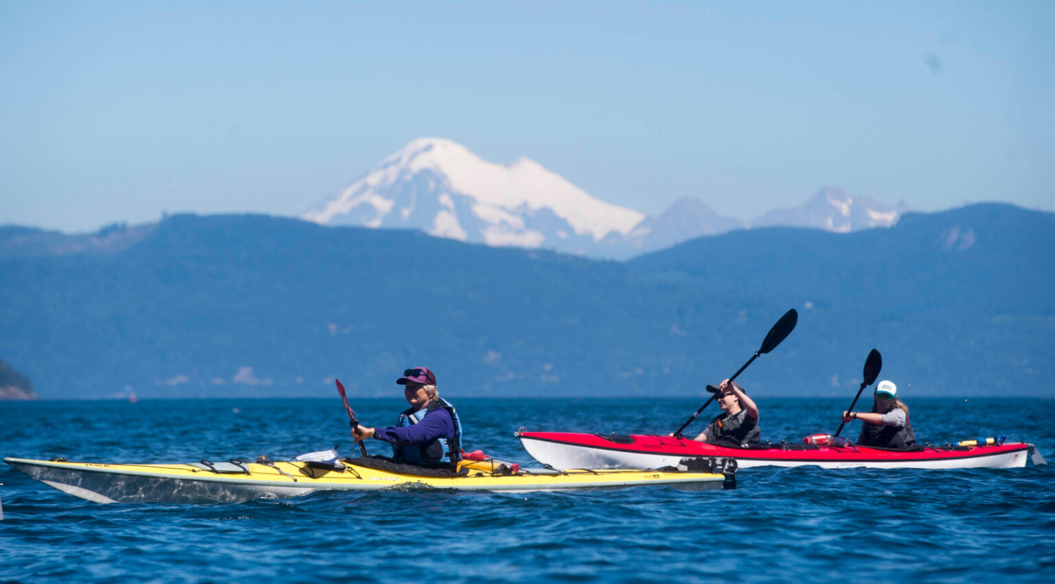 A photograph of teen summer kayaking trips in the Pacific Northwest