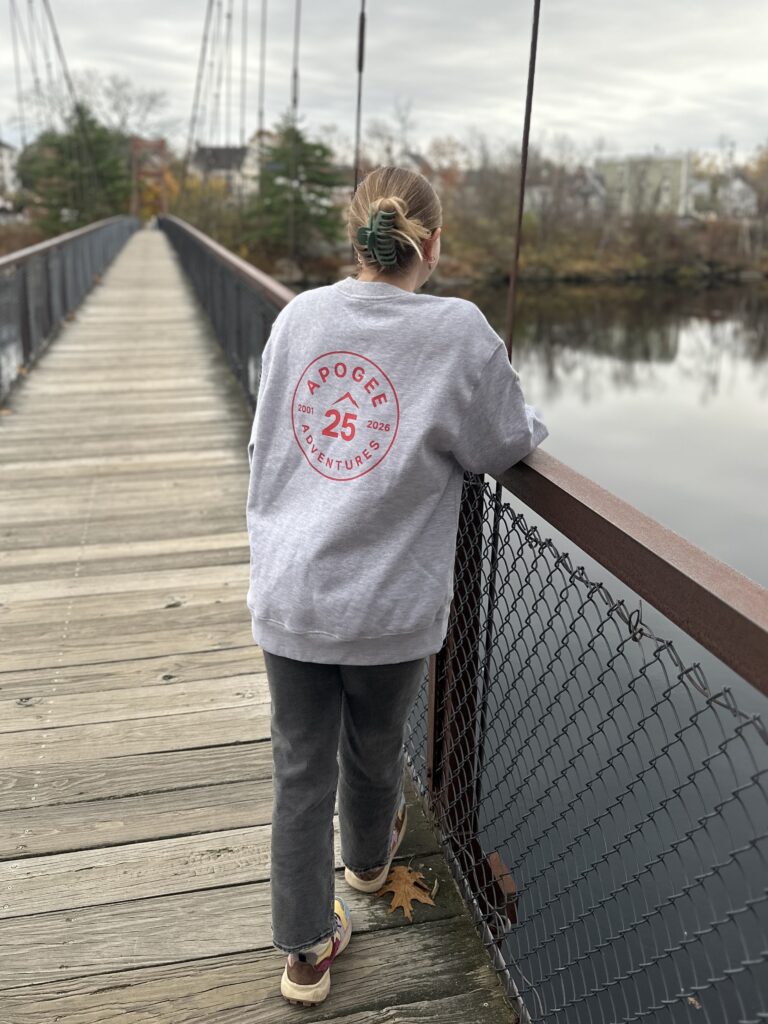 Assistant Director Olivia staying cozy in our crew neck.