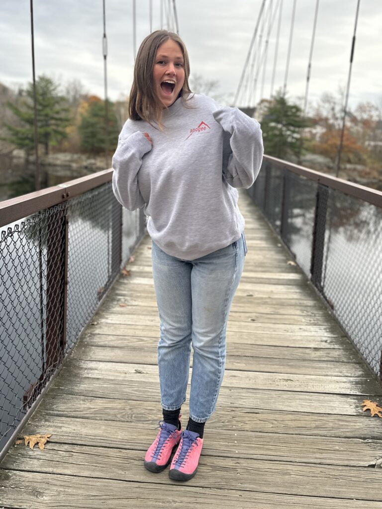 Assistant Director Lucia is excited about our first-ever crew neck!